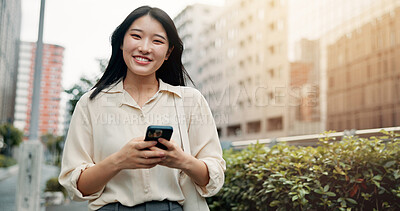 Buy stock photo Phone, travel and portrait of woman in city for networking, communication or typing email on vacation. Cellphone, contact and Japanese female person reading online blog for holiday tips in town.