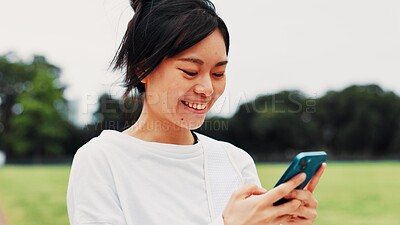 Buy stock photo Asian, happy woman and typing with phone in nature for communication, chat or online app at park. Japan, female person or user on mobile smartphone for texting, message or browsing network for sport