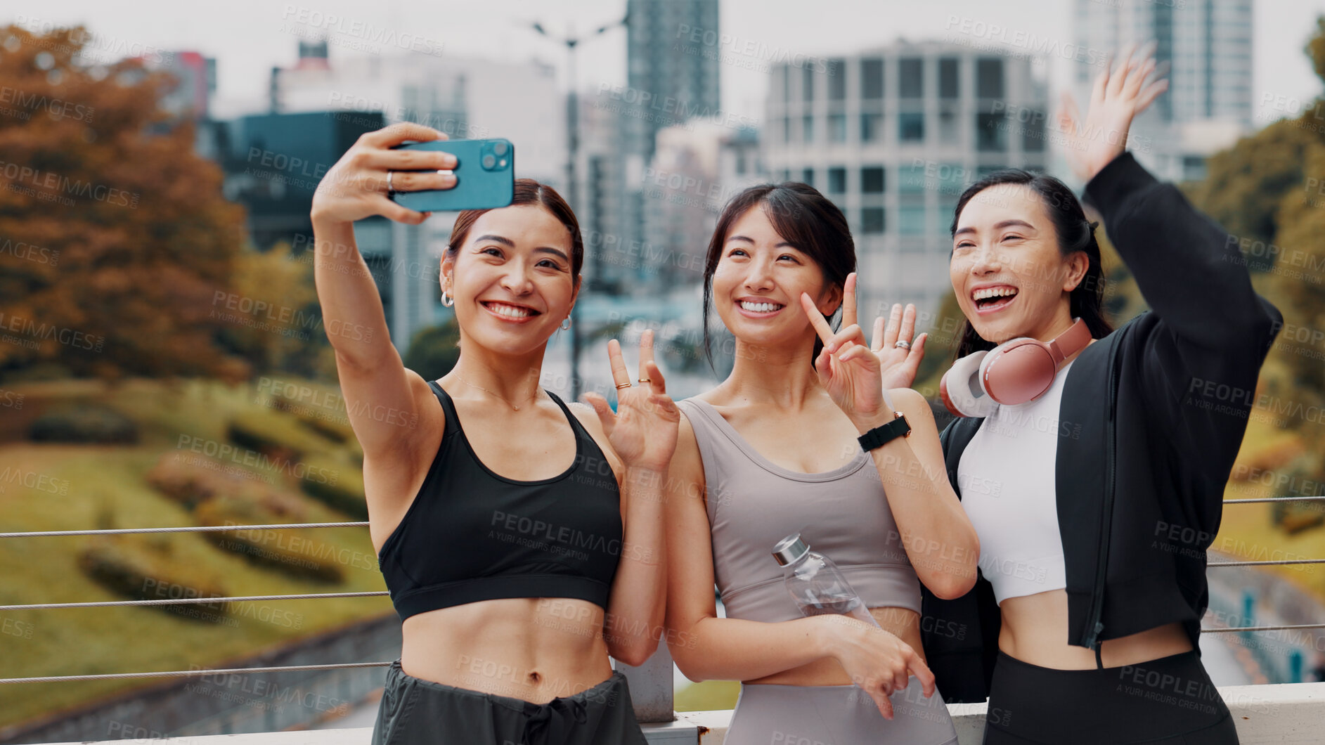 Buy stock photo Fitness, friends and selfie of women city together for workout break, body health and laugh. Happy group, sport and girls take picture outdoor for memory on social media, wave and peace sign in Japan