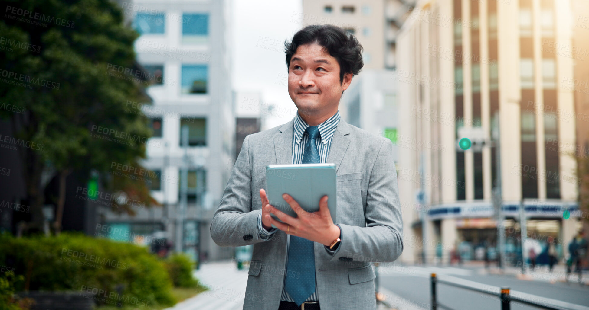 Buy stock photo Japanese man, city street and tablet for location search, direction and navigation with happiness. Male person, technology and smile on sidewalk for commute, travel and walk as real estate developer