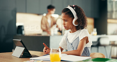 Buy stock photo Girl, tablet and education with studying in kitchen for elearning, video or headphones for online course. Child, notebook and touchscreen with point, scholarship and school project in family house