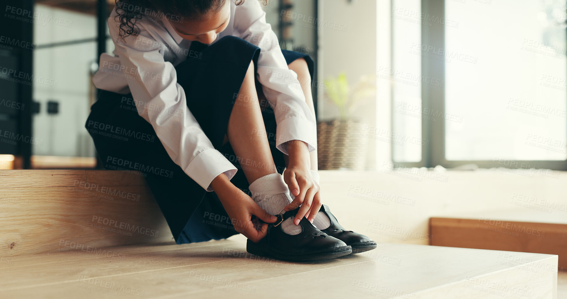 Buy stock photo Hands, child and tie shoes for school as morning routine,  getting ready in home or preparation for education. Feet, uniform and girl student with start to day for learning, dressing or footwear