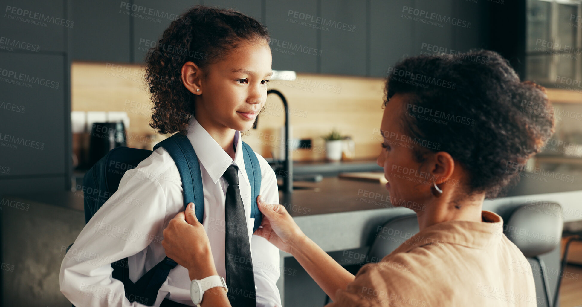 Buy stock photo Mom, girl and smile with backpack in home for preparing or ready for elementary education. Apartment, people and parent with kid in uniform for first day at school with joy, pride and child growth