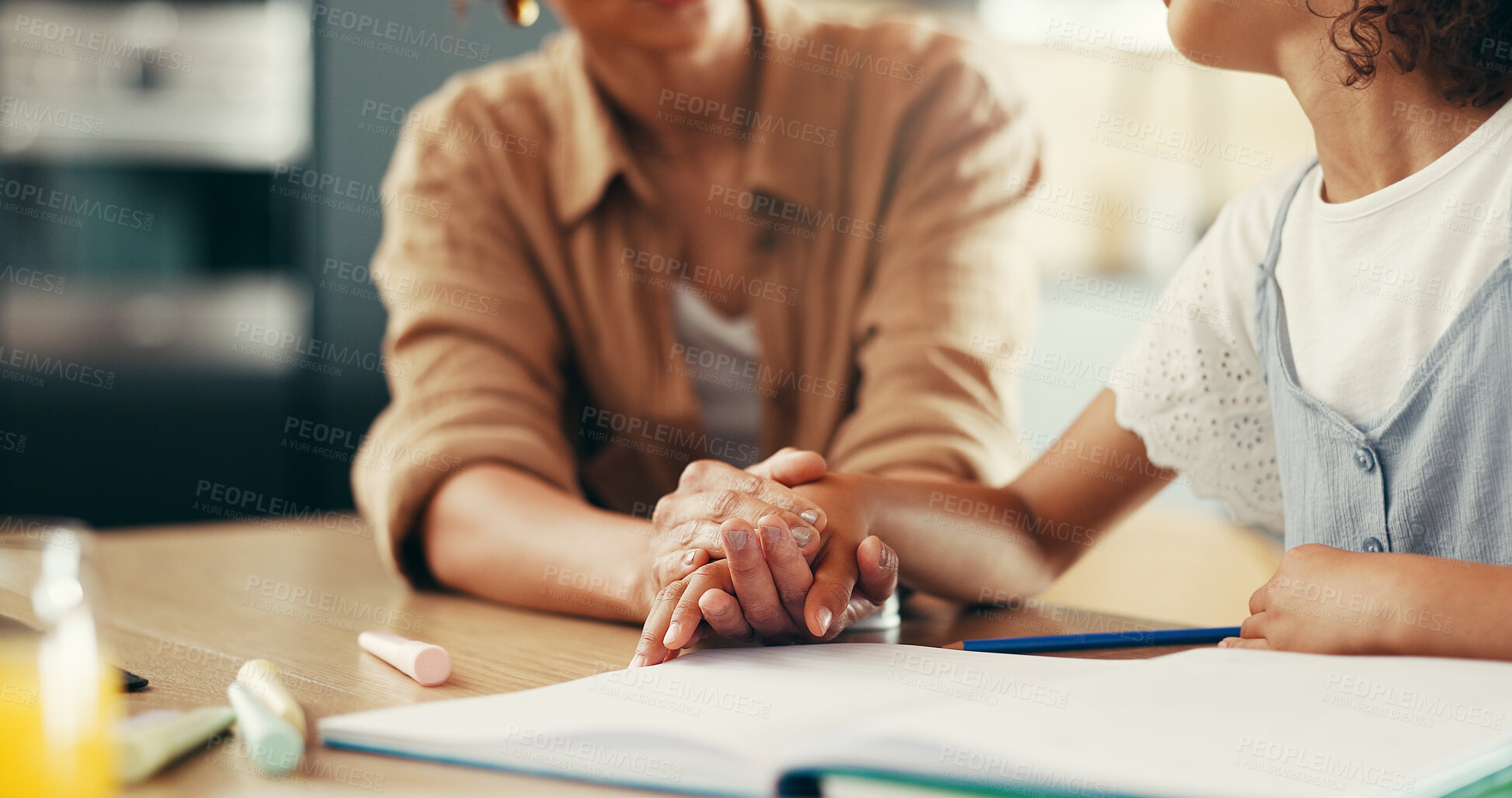 Buy stock photo Holding hands, mom and child with homework, education or support for development with learning disability. People, mother and kid with books, notes or empathy with adhd, study and care in family home