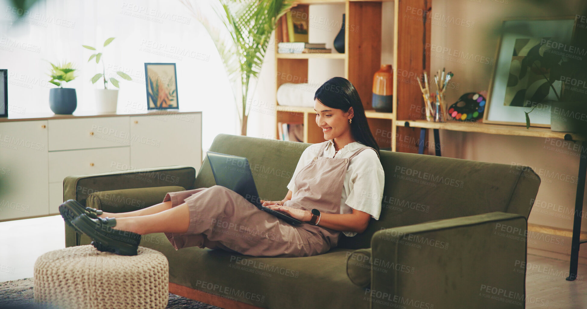 Buy stock photo Relax, happy and laptop with woman on sofa for social media, reading blog and streaming service. Networking, email and communication with person in living room at home for online news and website