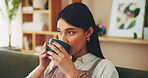 Home, relax and woman on sofa, coffee and comfort with aroma, thoughtful and resting in living room. Person, apartment and girl on couch, cappuccino and latte with herbal tea, thinking and break