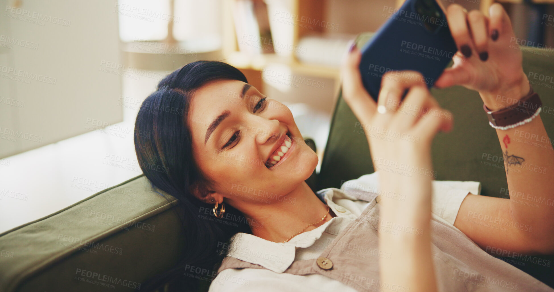 Buy stock photo Smile, phone and streaming with woman on sofa for subscription, social media and movie app. Connection, post and internet with female person in living room at home for mobile, web and relax.