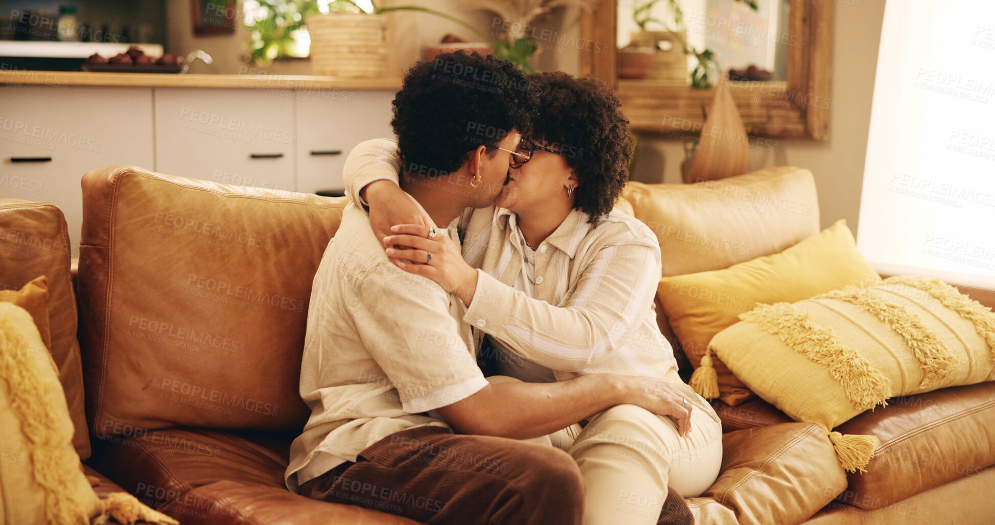 Buy stock photo Young couple, love and home with kiss, embrace and together in living room for affection. Woman, man and relationship for connection as romantic partner for bonding, happiness or support on honeymoon