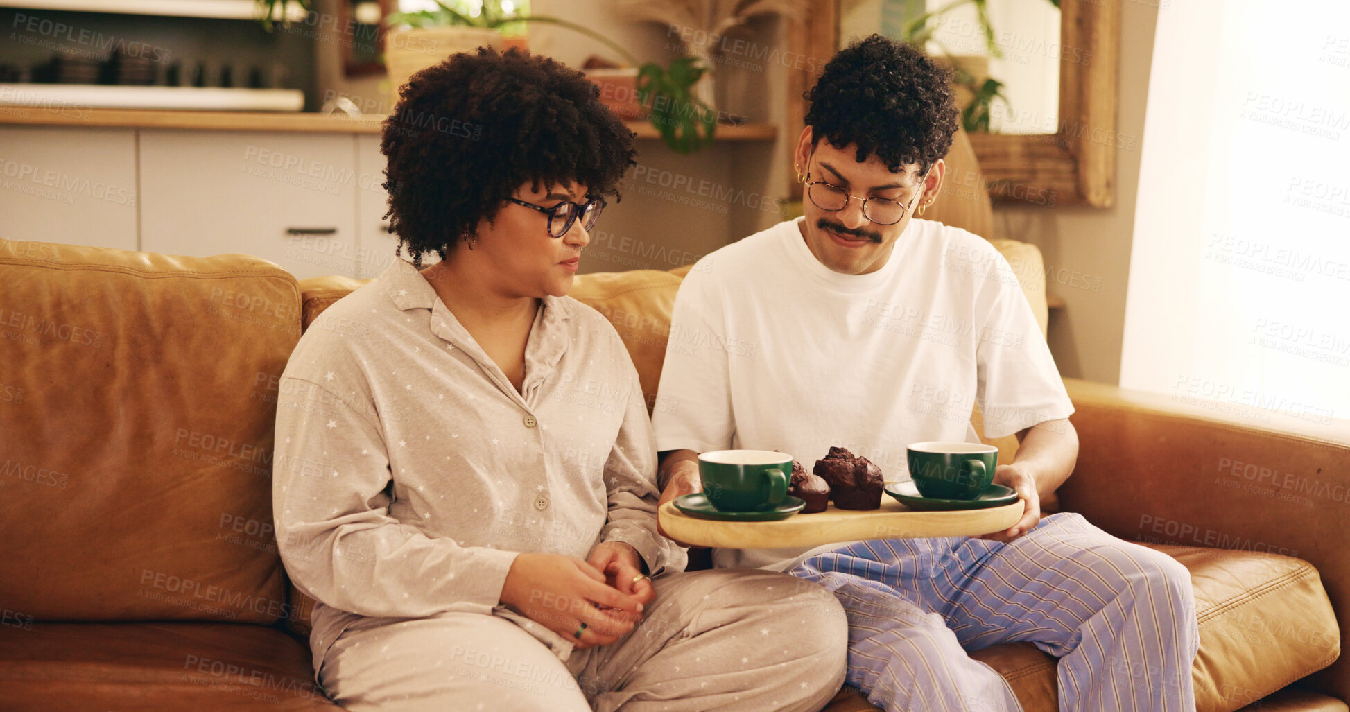 Buy stock photo Couple, relax and food with coffee at house for breakfast routine, valentines date and bonding together. People, resting and cake with beverage of romantic brunch, sweet snack and love in living room