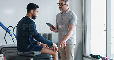 Buy stock photo Physiotherapy, tablet and knee pain with people in clinic for rehabilitation, healthcare or consulting. Support, medical and chiropractor with man and athlete for healing, advice or physical therapy 