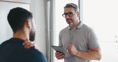 Buy stock photo Physiotherapy, tablet and shoulder pain with man and athlete in clinic for rehabilitation, healthcare or consulting. Support, medical and chiropractor with people for healing, advice or injury