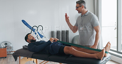 Buy stock photo Resistance band, physiotherapist and advice for stretching legs at clinic, helping and support. Men, flexibility exercise and chiropractor for rehabilitation treatment, consulting and healing service