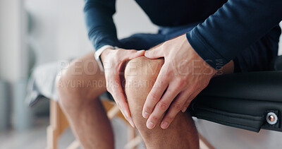 Buy stock photo Hands, knee pain and injury on bed at physiotherapy at clinic with recovery, process and relief for legs. Person, patient and massage for ache, joint and rehabilitation for wellness at hospital