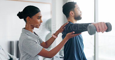 Buy stock photo Care, man and woman in physiotherapy with dumbbell for fitness, muscle workout or exercise. Rehabilitation, physiotherapist and patient in office together for help, support and mobility training