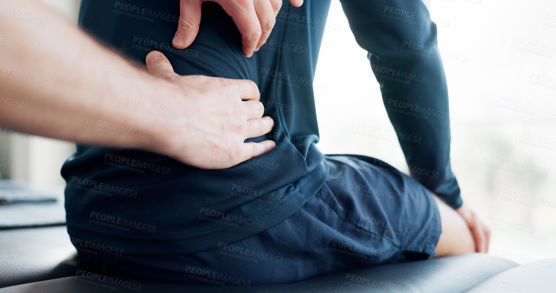 Buy stock photo Hands, back pain and injury for massage with physiotherapy at clinic with recovery, process and relief for legs. Person, patient and help for ache, spine and rehabilitation for wellness at hospital