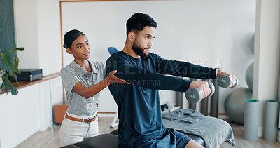 Buy stock photo Help, man and woman in physiotherapy with weights for fitness, muscle workout or exercise. Rehabilitation, physiotherapist and patient in office together for support, dumbbell and mobility training