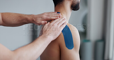 Buy stock photo Physiotherapist, person and hands with tape for recovery, injury and guide for health at clinic. People, help and support with exercise for shoulder pain with muscle in rehabilitation at hospital