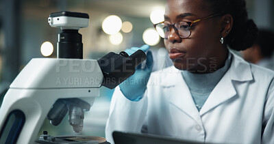 Buy stock photo Black woman, scientist and microscope for disease research and medical study with pharma investigation. Virus, biotechnology and vaccine test for health science with working healthcare professional