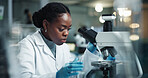 Black woman, scientist and microscope for lab research and medical study with pharma investigation. Virus, biotechnology and vaccine testing for health science with working healthcare professional