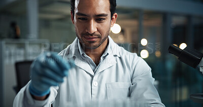 Buy stock photo Scientist, man and test tube by microscope in lab with chemical, check and process for vaccine development. Person, glass container and medical research with insight for drugs in pharmaceutical trial