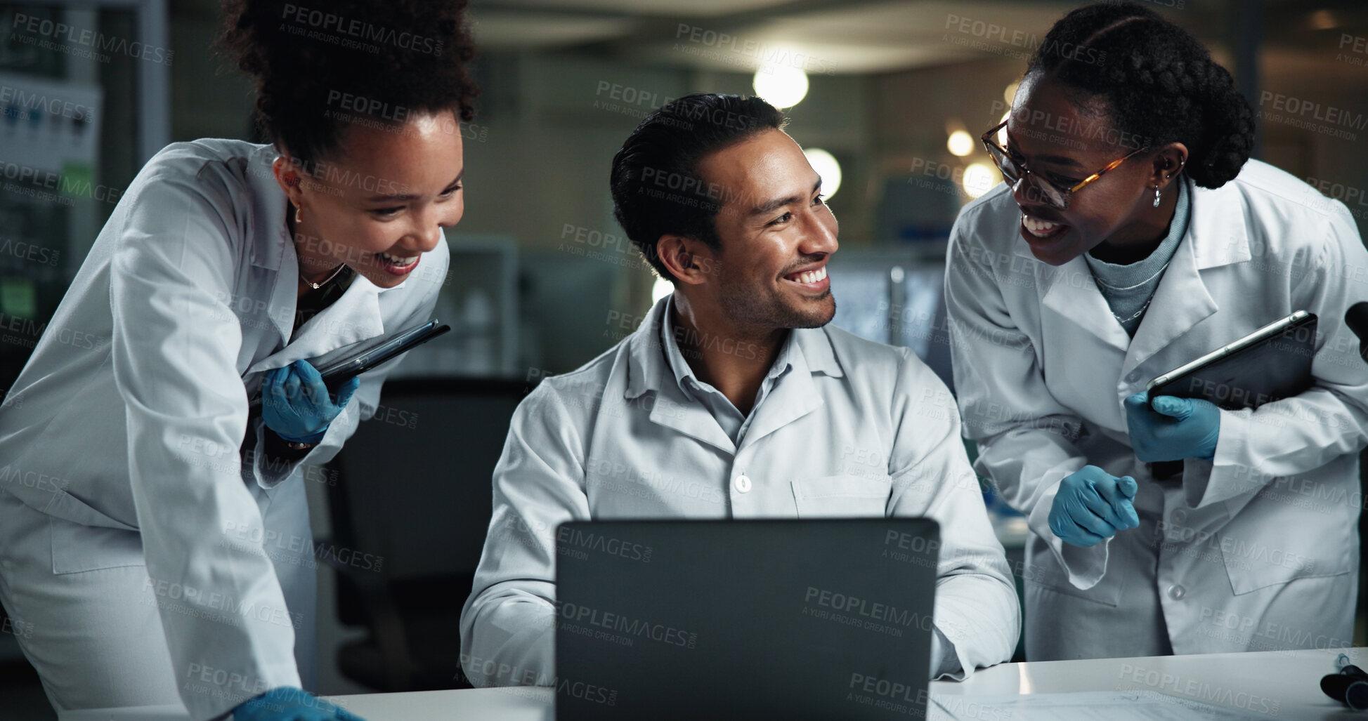 Buy stock photo Man, team and happy scientist with laptop at laboratory for results, progress and medical research. People, group and excited with diversity at night for drugs, vaccine or good news for pharma career