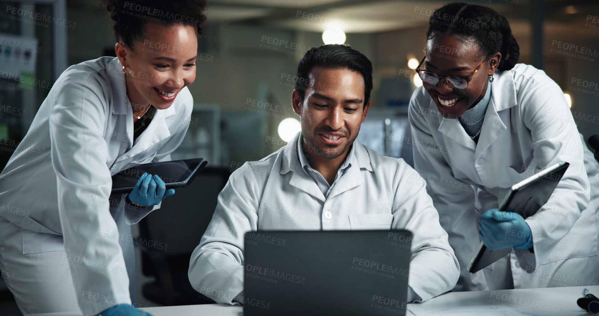 Buy stock photo Man, group and happy scientist with laptop at laboratory for results, progress and medical research. People, team and reading with diversity at night for drugs, vaccine or good news for pharma career