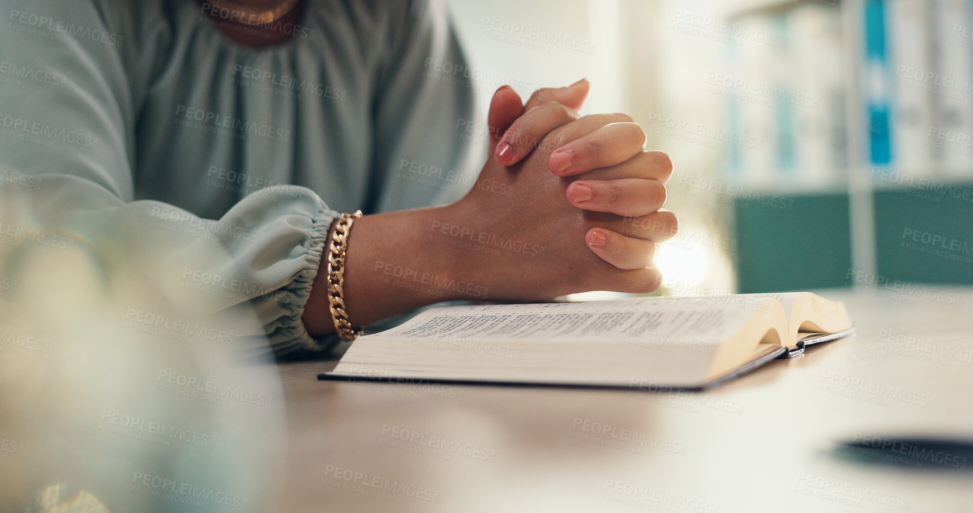 Buy stock photo Hands, prayer and bible for religion in home with worship, peace and reading for spiritual guide. Person, Christian book and faith with reflection with scripture for connection to God at apartment