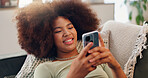 Smile, mobile and woman online on sofa, texting and reading social media blog post to relax. Happy, phone and African girl in home for communication, streaming show and download chat app on internet