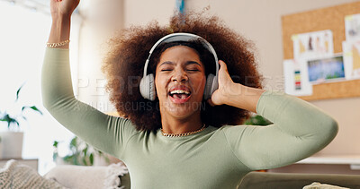 Buy stock photo Fun, listening and woman with headphones, house and streaming of music, singing or online for sound. Home, digital and dancing in living room, hearing and subscription for audio, African or apartment