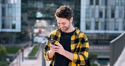 Buy stock photo Phone, happy and man in city typing for communication, networking or contact with mobile app. Tech, travel and male person with smile on social media with cellphone outdoor in town for texting online