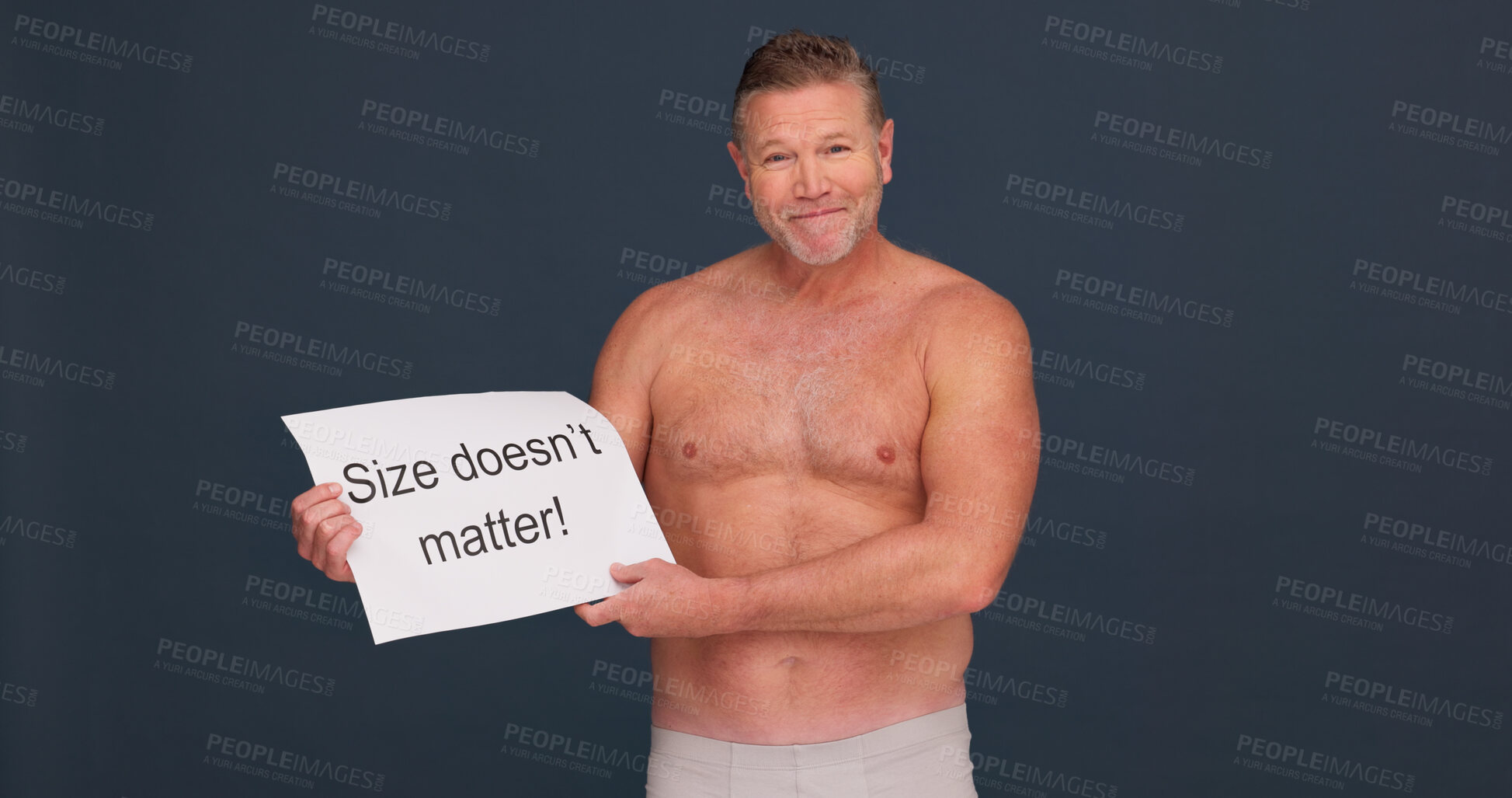 Buy stock photo Portrait, man and paper for body positivity in studio, acceptance or shirtless with space on dark background. Face, confidence and mature person with poster for pride, size and message for self love