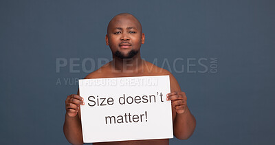 Buy stock photo Man, portrait or paper sign for body positivity with pride, topless or self love at studio space. Plus size model, African or poster on dark background for opinion, acceptance or confident in Kenya