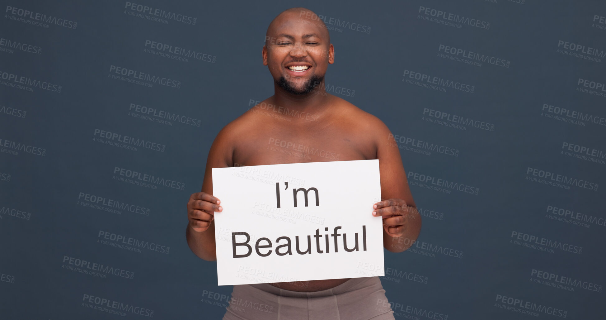 Buy stock photo Happy man, portrait or paper sign for body positivity with pride, topless or self love at studio space. Plus size model, African or excited on dark background with poster acceptance or voice in Kenya