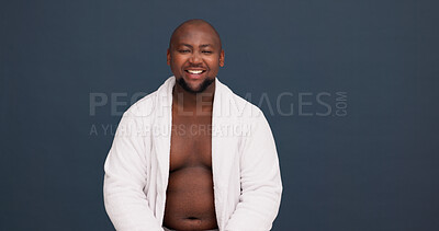 Buy stock photo Portrait, confident and black man in studio, smile and happy for body positivity, bathrobe and joy. Mockup, proud and person with acceptance, healthy and model with self esteem, wellness and space