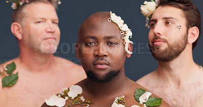 Buy stock photo Beauty, studio and portrait of men with flowers for cosmetics, wellness and spa aesthetic. Salon, inclusion and queer people with plants for natural skincare, pride and lgbtq on blue background