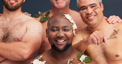 Buy stock photo Beauty, happy and portrait of men with flowers in studio for cosmetics, wellness and spa treatment. Lgbtq, diversity and queer people with plants for natural skin, aesthetic and health on background