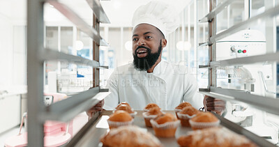 Buy stock photo Muffin, bakery and cooking with black man in kitchen for coffee shop, food industry and breakfast. Shelf, chef and nutritionist with baker and dessert in restaurant for baking, cafe and order