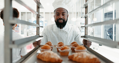Buy stock photo Muffin, bakery and portrait with man in kitchen for coffee shop, food industry and breakfast. Shelf, chef and nutritionist with male baker and dessert in restaurant for baking, cafe and order