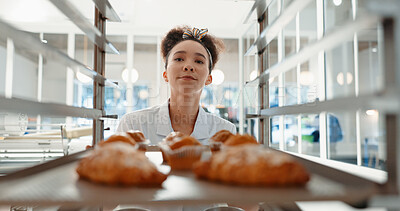 Buy stock photo Croissant, bakery and cafe with woman in kitchen for coffee shop, food industry and breakfast. Shelf, chef and nutritionist with baker and dessert trolley in restaurant for baking, hotel and pastry