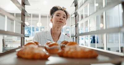 Buy stock photo Croissant, bakery and pastry with woman in kitchen for coffee shop, food industry and breakfast. Shelf, chef and nutritionist with baker and dessert trolley in restaurant for baking, hotel and cafe
