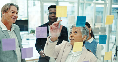 Buy stock photo Glass wall, group and business people in office with sticky note, information or meeting for project. Collaboration, board and team of creative journalists planning media press release in workplace.