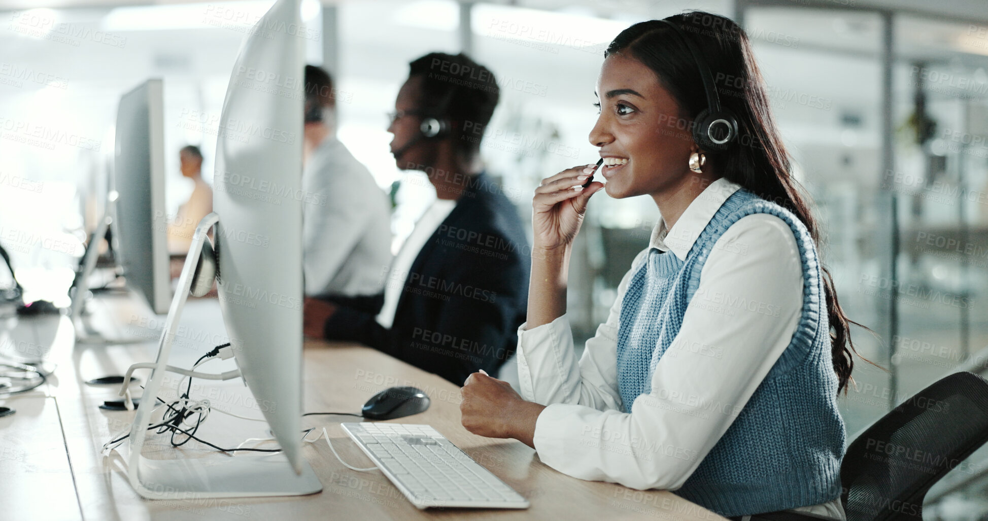 Buy stock photo Call center, computer and consulting with Indian woman in support office for customer service. Contact us, feedback and smile with happy person speaking on headset at work for advice or virtual help
