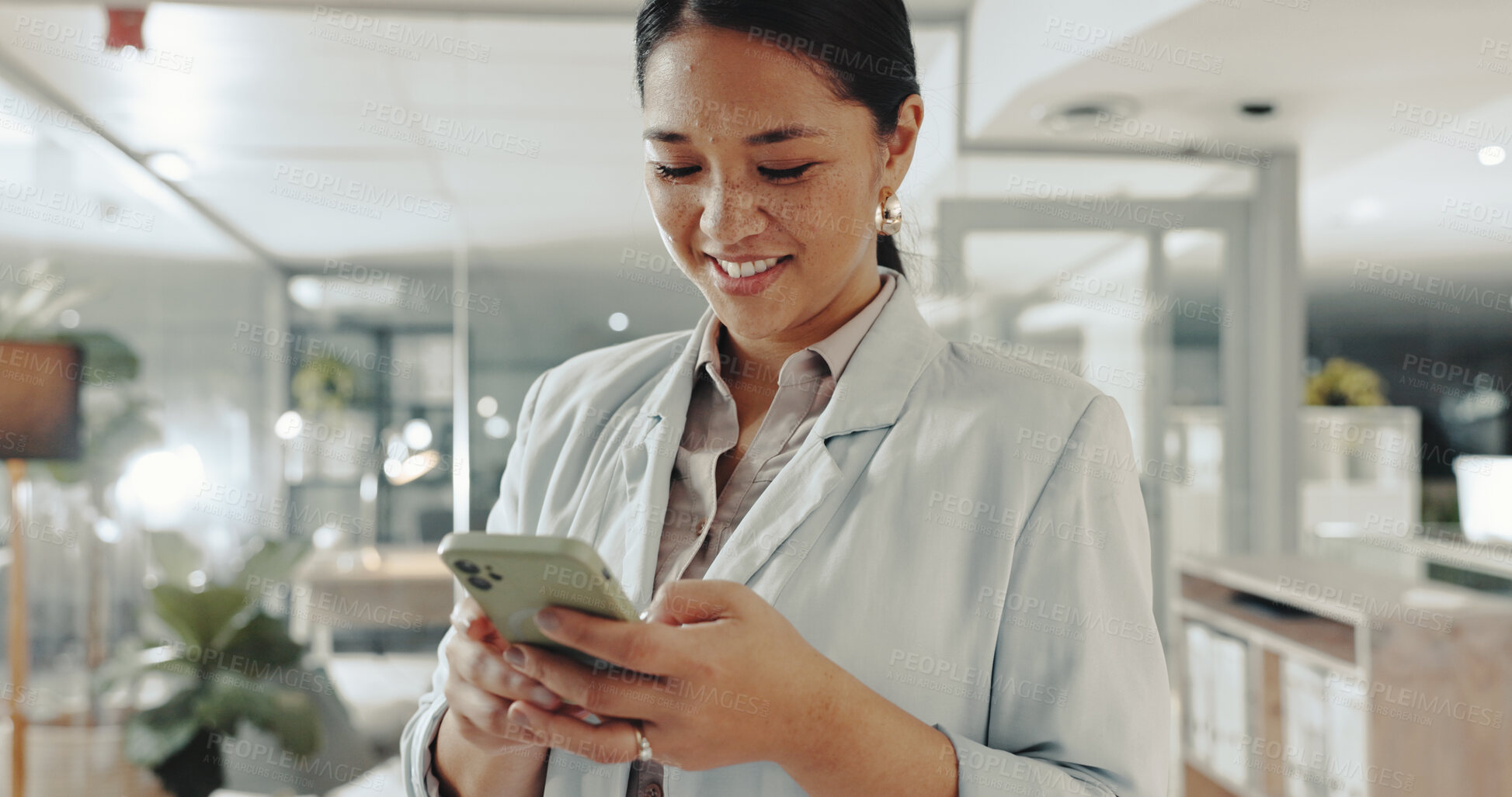 Buy stock photo Smile, phone and businesswoman in office with typing for email, communication or networking. Technology, research and Asian female attorney with cellphone for contact on company policies online.