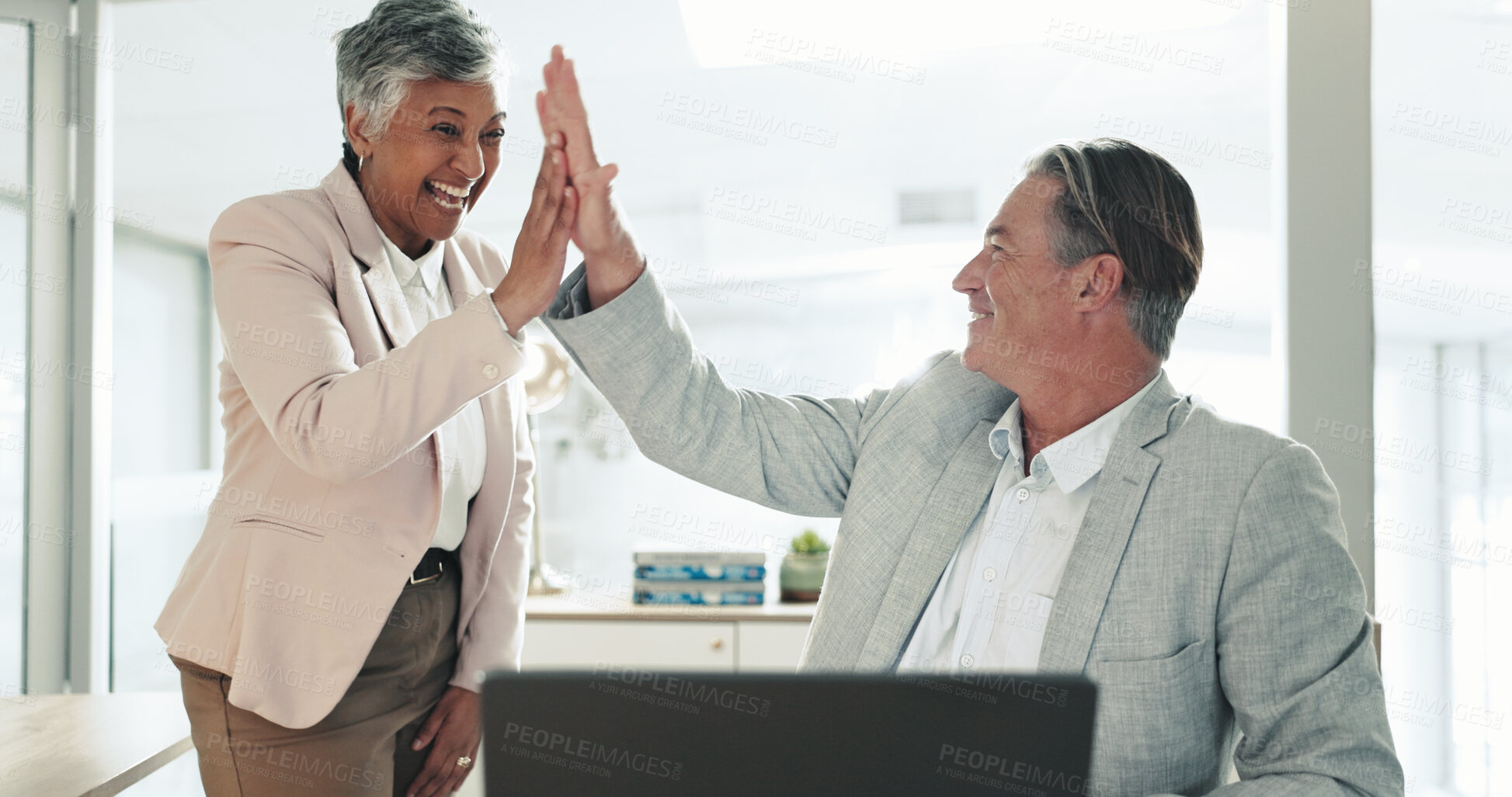 Buy stock photo Mature, happy or business people with high five for teamwork, winning or celebration at office. Senior man, woman or colleagues with smile or touch for good job, achievement or promotion at workplace