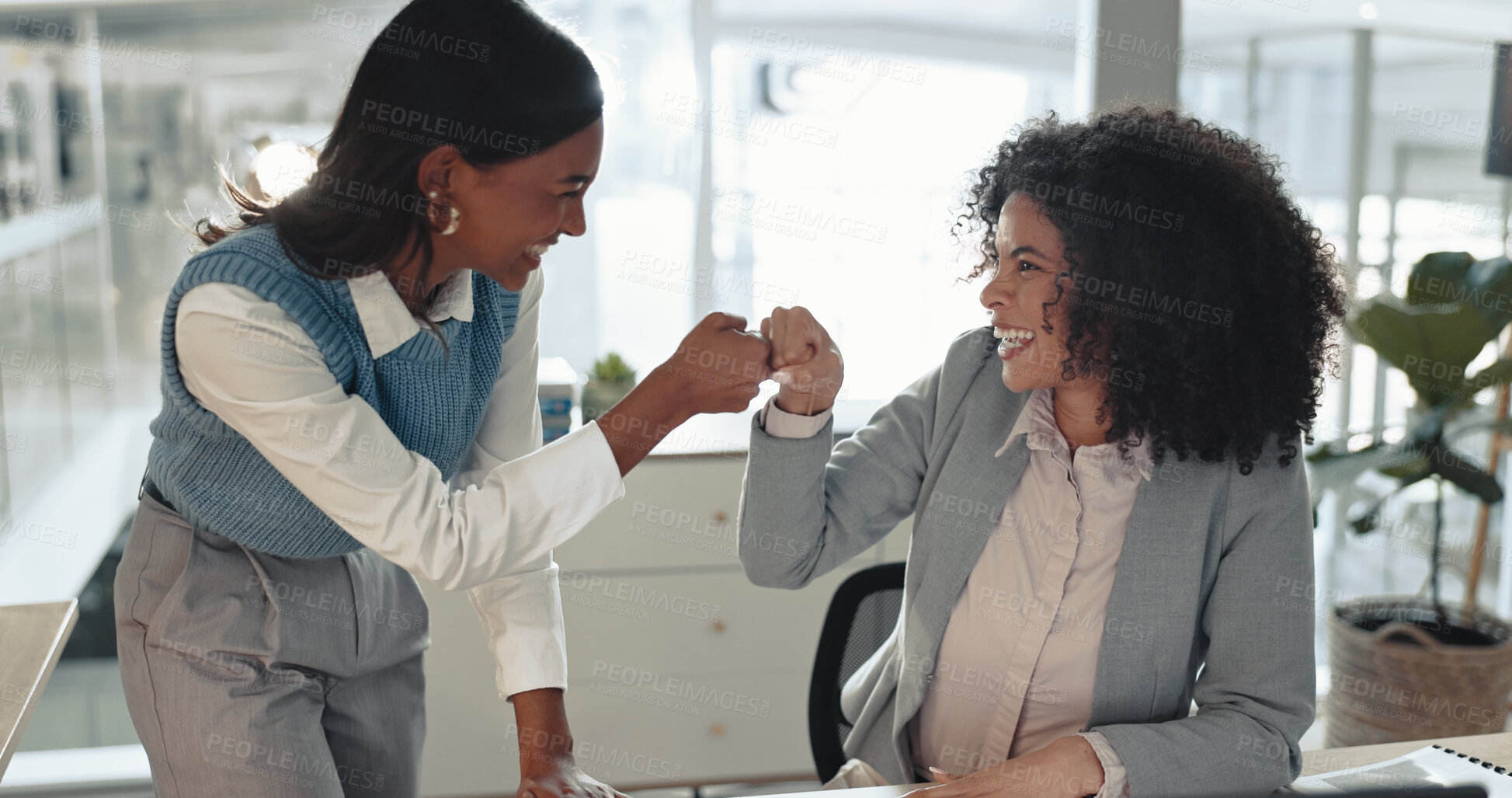 Buy stock photo Excited, business women or fist bump with teamwork for winning, celebration or good job at office. Female people, employees or colleagues with touch or smile for well done, great news or productivity