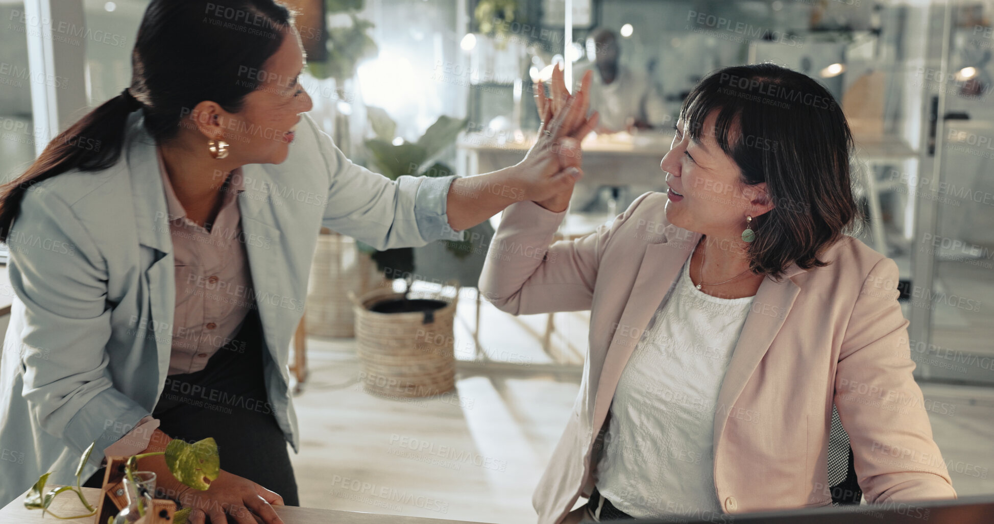 Buy stock photo Hugh five, smile and success with business women at desk in office together for celebration. Complete, motivation and support with winner colleague people in workplace for bonus, goals or target