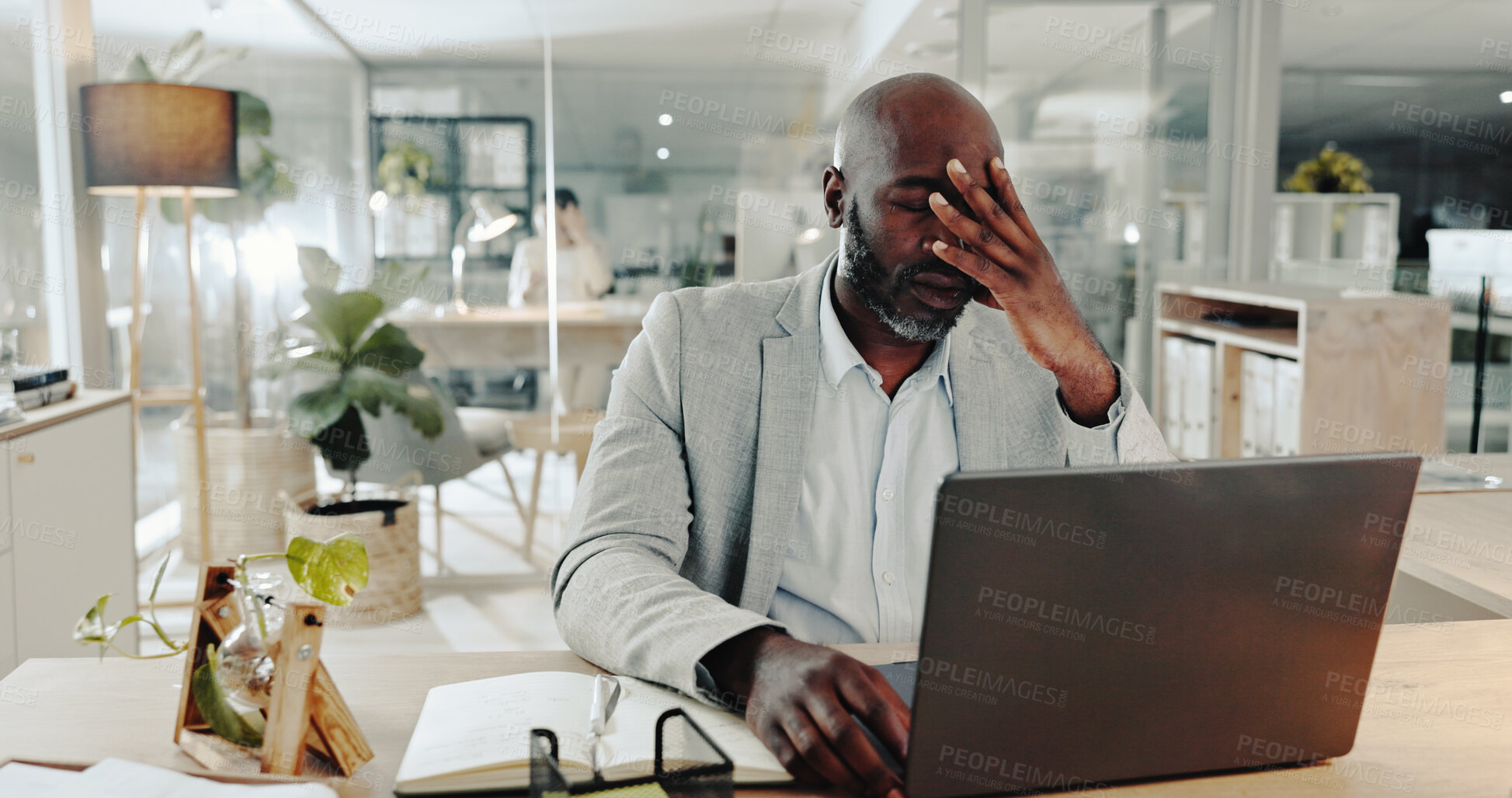 Buy stock photo Burnout, laptop and stress with business black man at desk in office for audit or tax deadline. Computer, headache and mistake with error or fail of professional employee in workplace for reporting