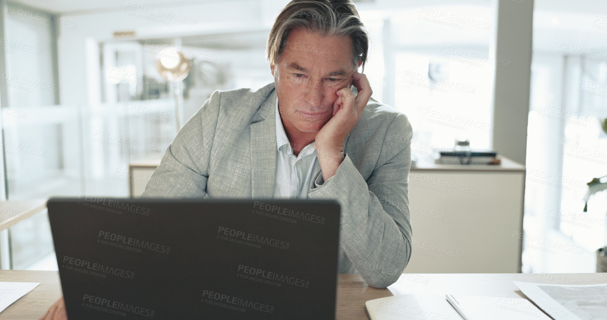 Buy stock photo Bored, thinking and business man on laptop in office with upset, annoyed and frustrated reaction. Professional, corporate worker and face of mature person with fatigue, tired and burnout on computer