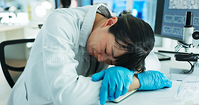 Buy stock photo Sleeping, burnout and scientist with headache, lab and tired of medical research, woman and overwhelmed. Exhausted, overtime and person with stress for project, thinking and migraine for setbacks