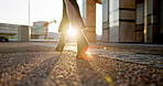 Business, walking and shoes of woman in city with sunrise, travel and metro station for transport. Sunshine, urban sidewalk and feet of businesswoman on morning commute with light flare on ground